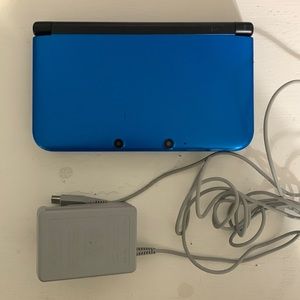 Nintendo 3DS XL Blue with charger and 4 games.